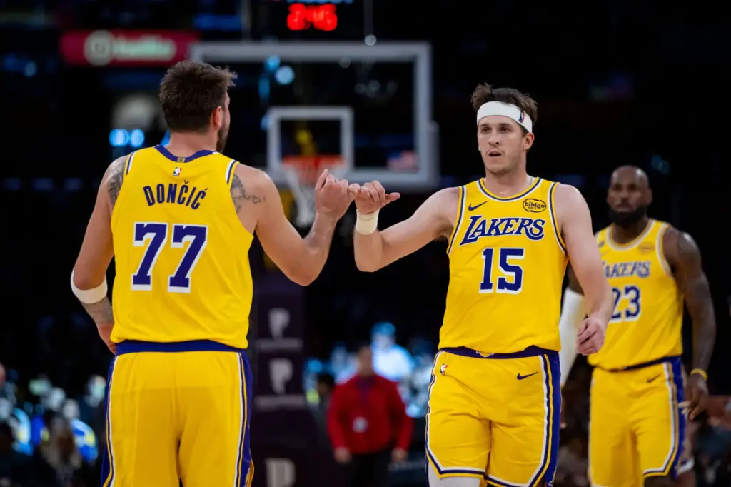 Lakers star Luka Doncic, left, and teammate Austin Reaves celebrate...