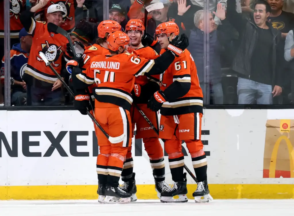 The Ducks’ Beckett Sennecke (45) celebrates his goal with Leo...