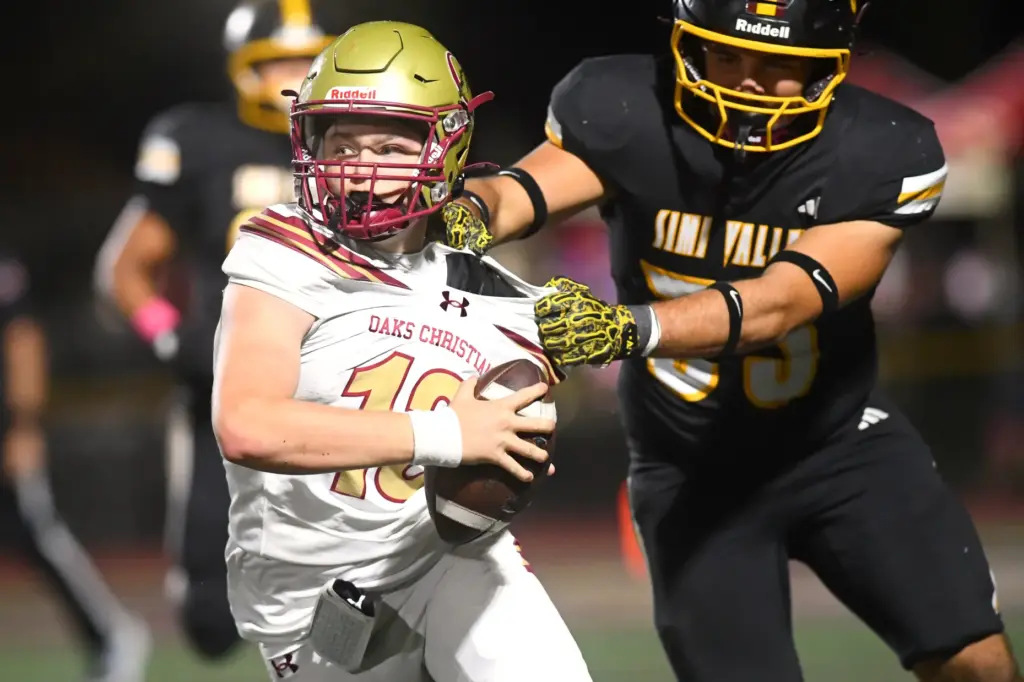 Simi Valleyâs Brody Samon tackles Oaks Christian quarterback Cody Bird...