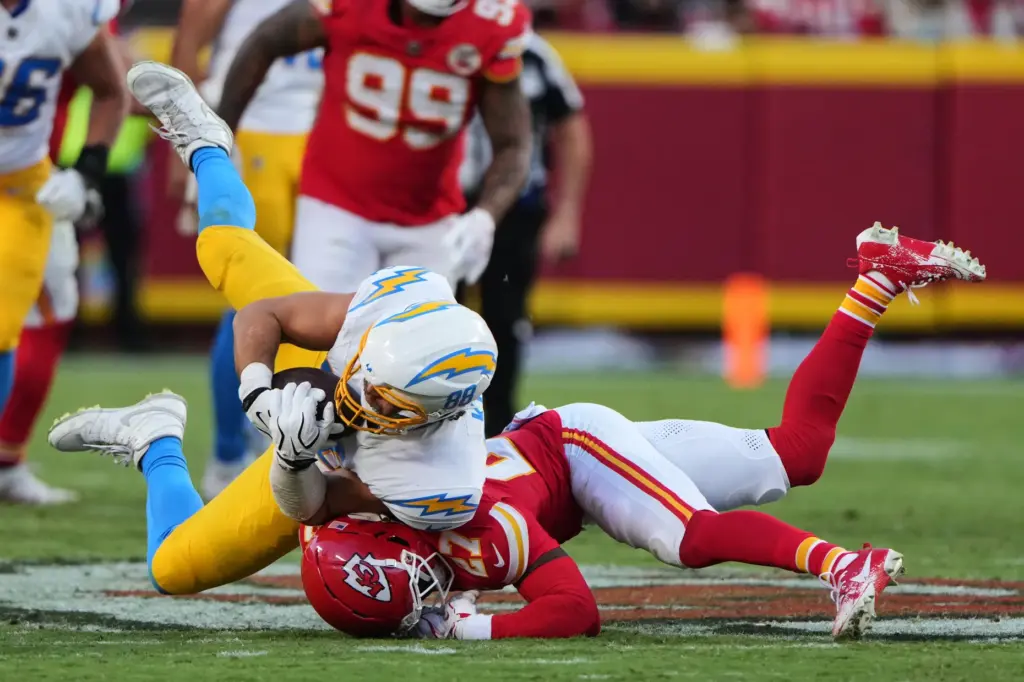 Chargers tight end Charlie Kolar (88) is tackled by Kansas...