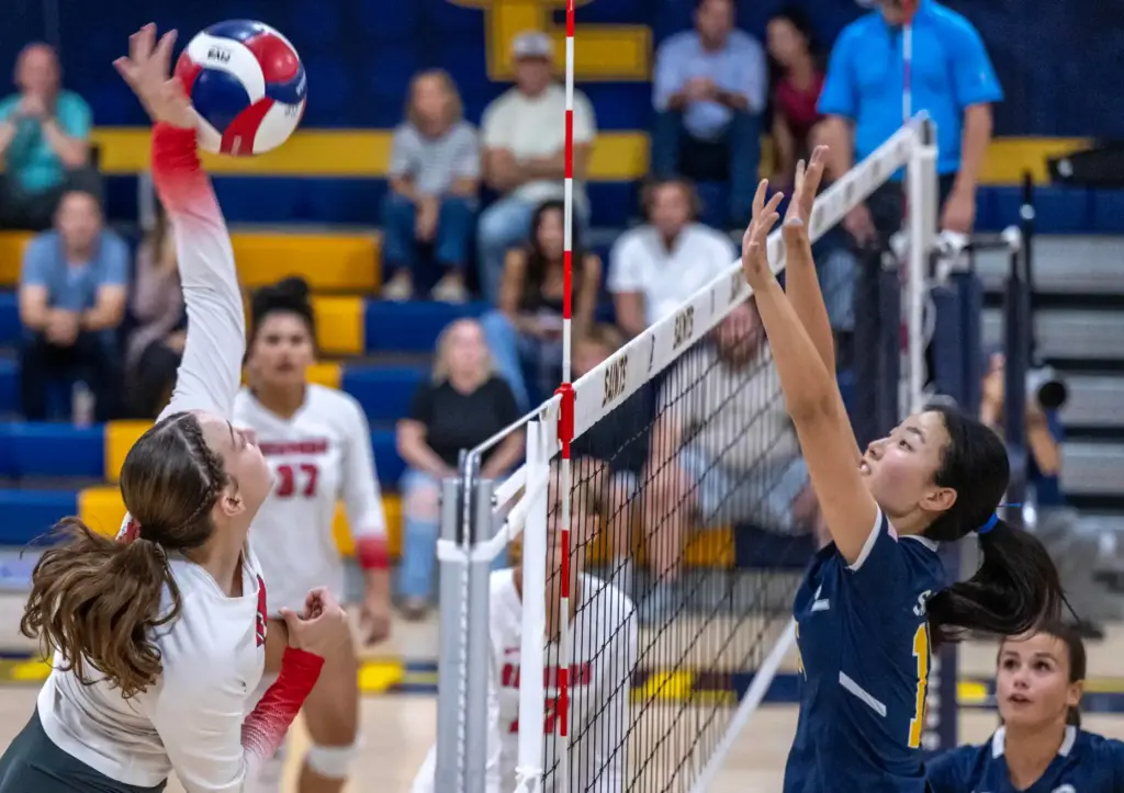 Redondo Union outside hitter Leah Blair (12) hits the ball...