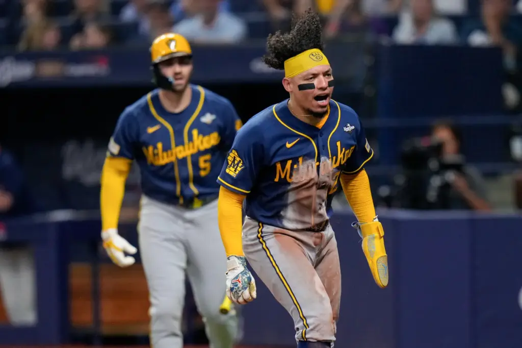 The Milwaukee Brewers’ William Contreras celebrates scoring on a sacrifice...