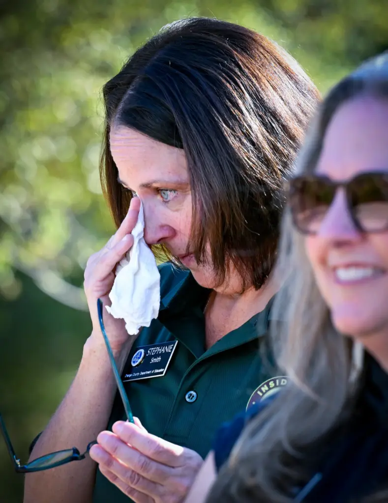 Stephanie Smith, operations manager for Inside the Outdoors, becomes emotional...