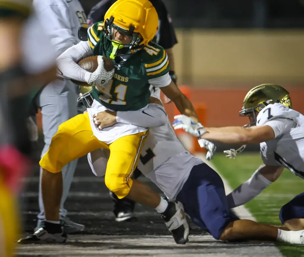 Edisonâs Drake Sunga, left, is forced out-of-bounds by San Juan...