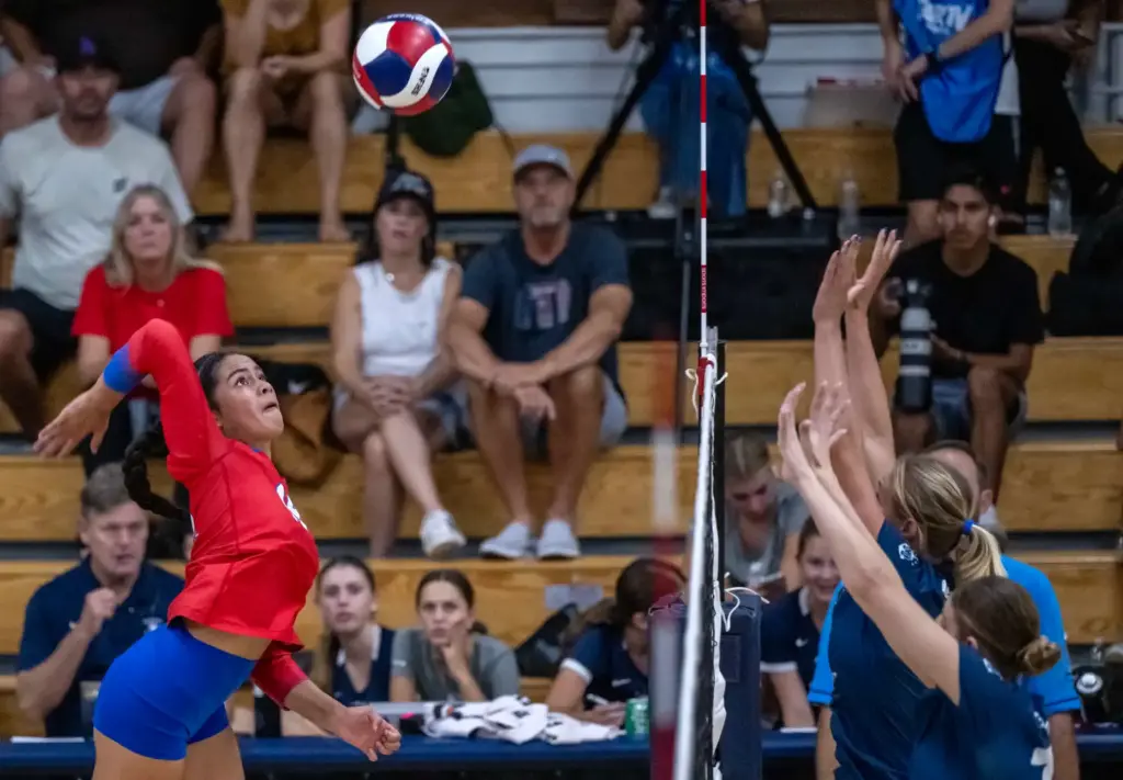 Los Alamitos outside hitter Tyleani Allen (19) hits the ball...