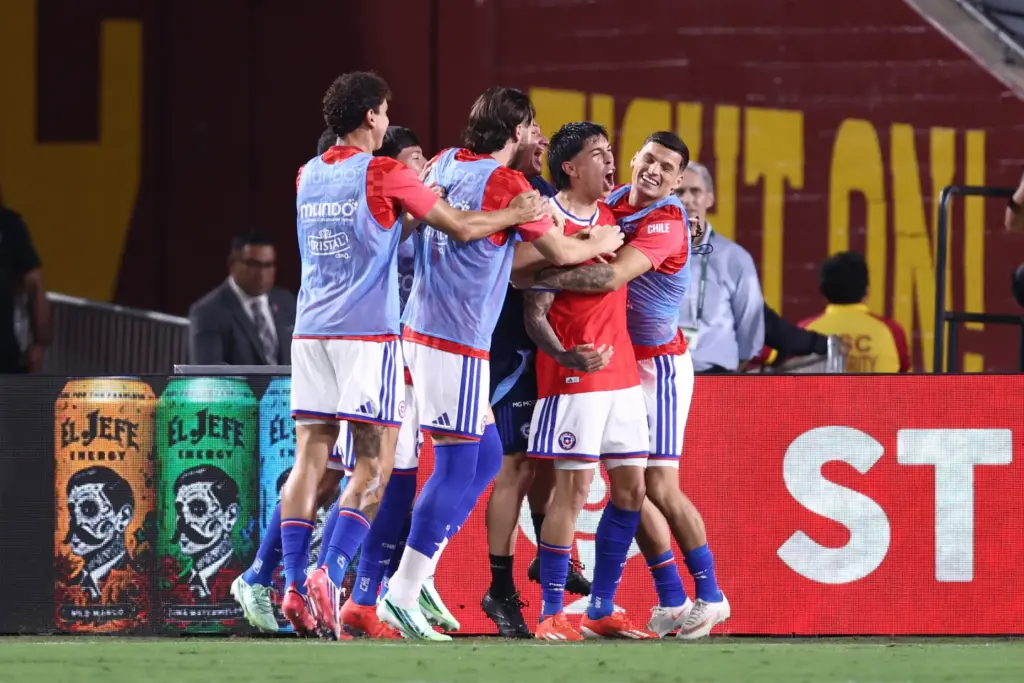 Chile forward Maximiliano GutiÃ©rrez, second from right, celebrates with teammates...