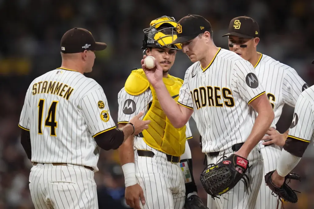 San Diego Padres starting pitcher Nick Pivetta, right, is removed...