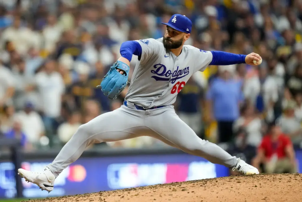 Dodgers relief pitcher Tanner Scott throws to the plate during...