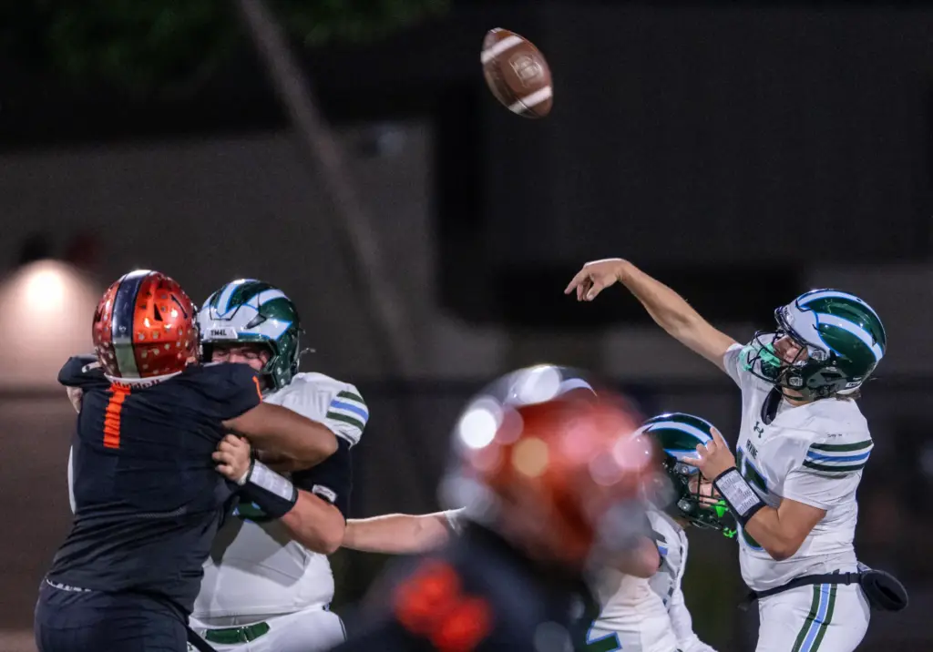 Irvine quarterback Ronin Scheinblum (15) throws the ball during a...