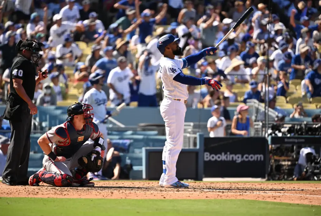 The Dodgers’ Teoscar HernÃ¡ndez watches the flight of his two-run...