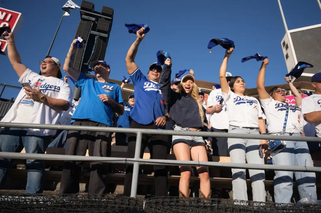 Dodgers fans cheer at the start of Game 3 of...