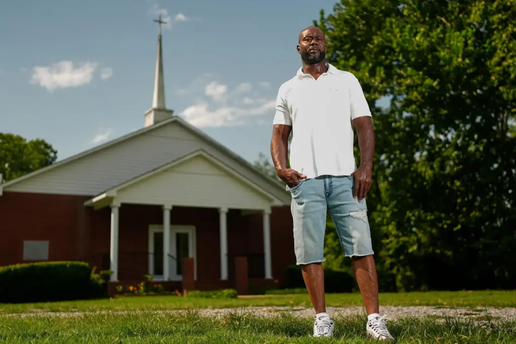 Patrick Dewayne Smith poses for a portrait outside his church...