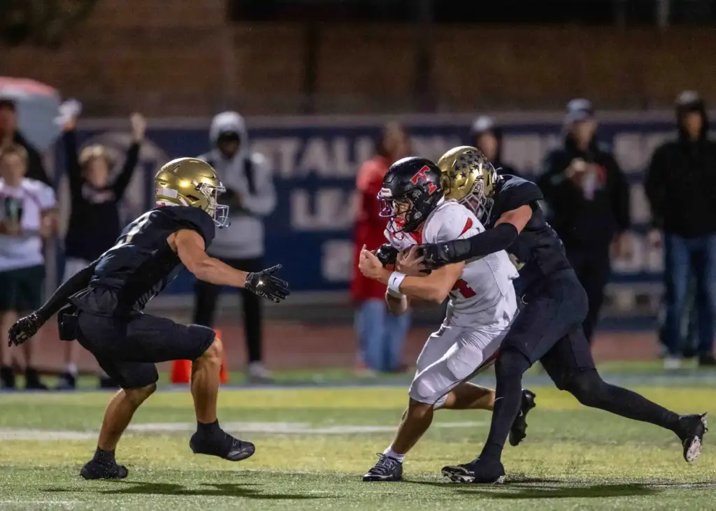 San Clemente wide receiver Jaxson Rex (14) carries the ball...