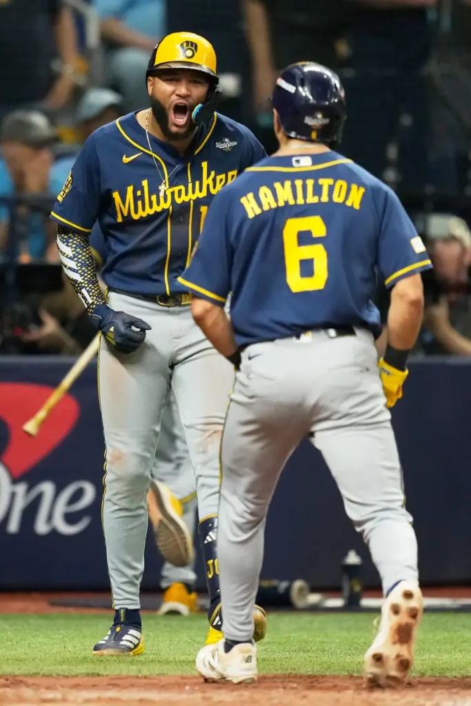 The Milwaukee Brewers’ David Hamilton, right, celebrates his home run...