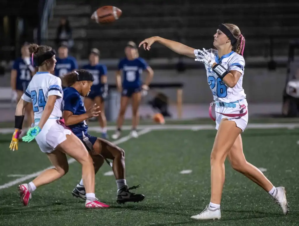 Corona del Mar quarterback Charlotte Ring (26) throws the ball...