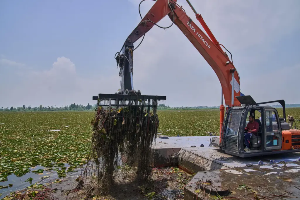 A machine clears weeds from Dal Lake in Indian controlled Kashmir.