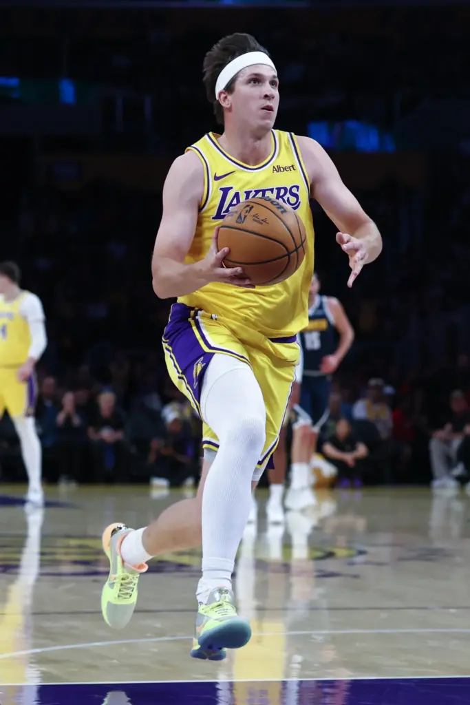 Lakers guard Austin Reaves drives to the basket during the...