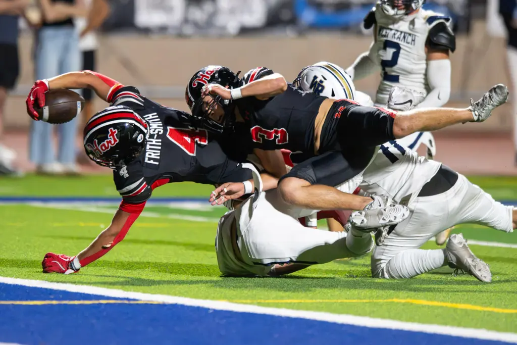 Hart High School’s Matix Frithsmith (4) carries the ball for...