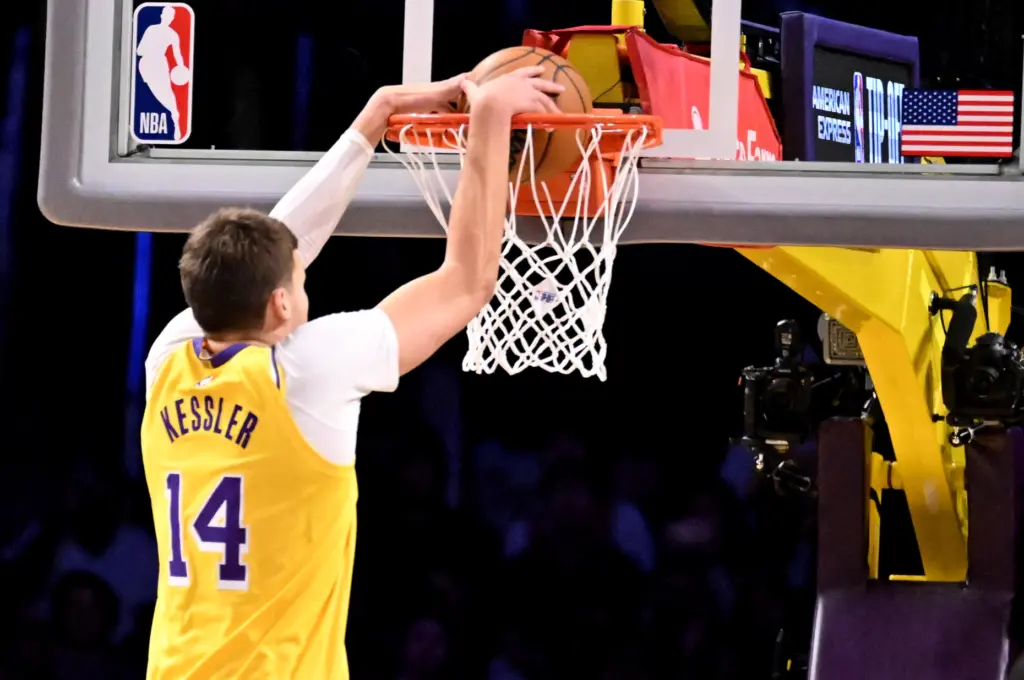 Lakers center Walker Kessler dunks during the first half of...
