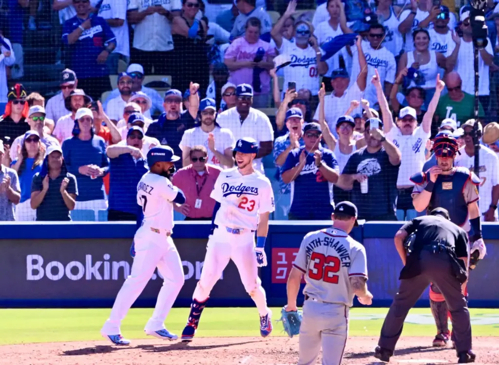 The Dodgers’ Kyle Tucker (23) celebrates with teammate Teoscar Hernandez,...