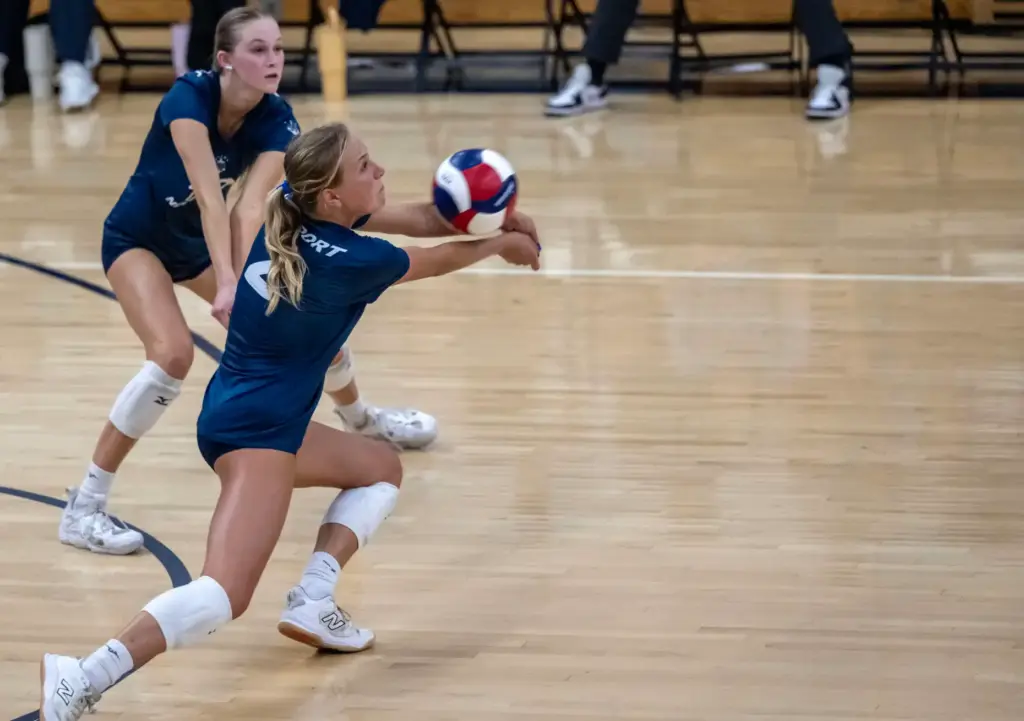 Newport Harbor outside hitter Ella Olson (2) digs the ball...