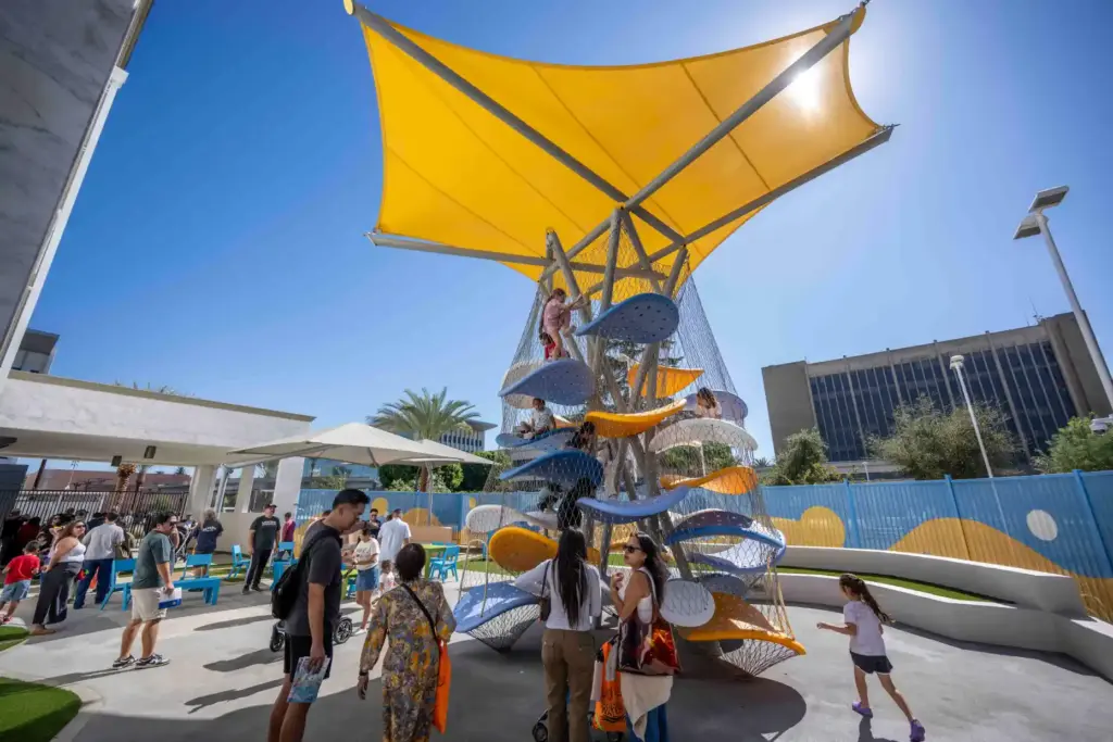 Kids climb inside a play structure behind the newly renovated...