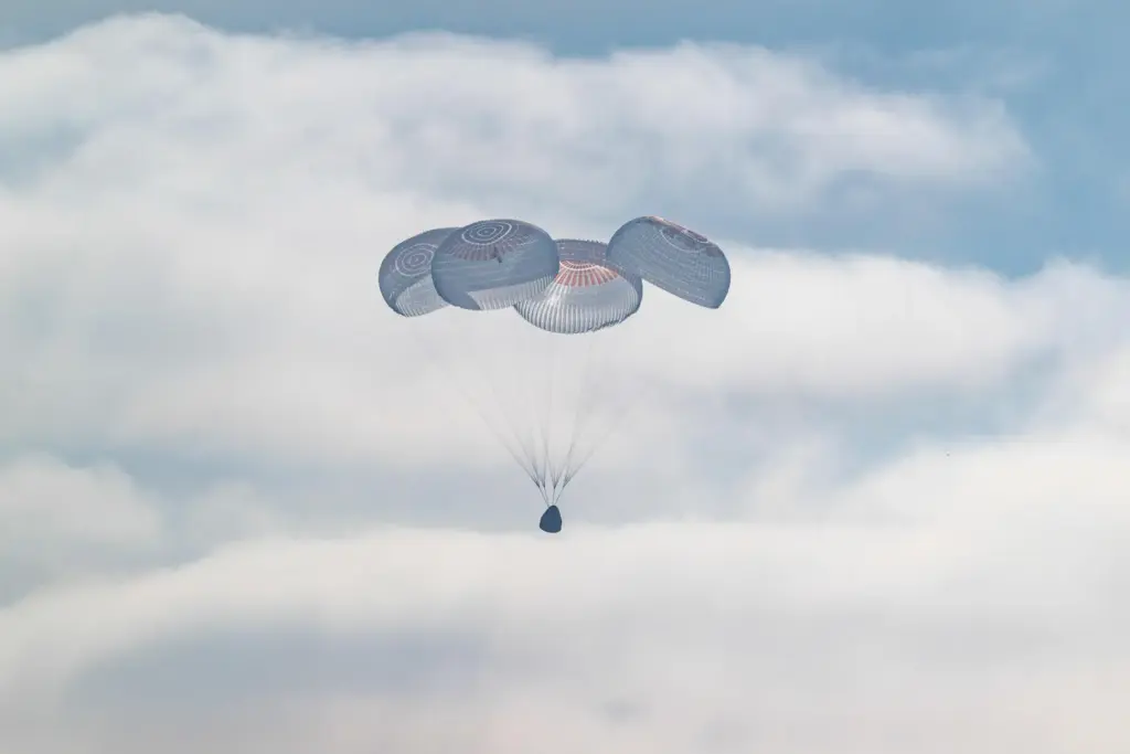 In this photo provided by NASA, the SpaceX Crew Dragon...