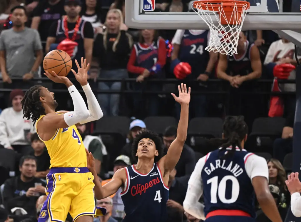 Lakers guard Matisse Thybulle, left, shoots over Clippers guard Kobe...
