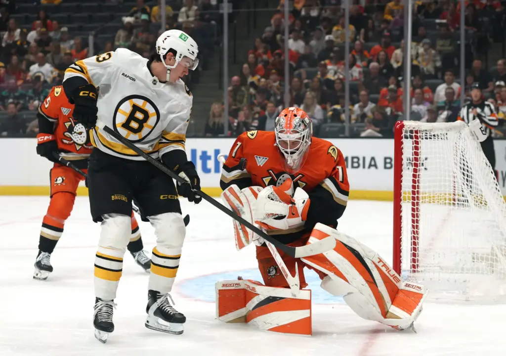 Ducks goaltender Lukas Dostal, right, makes a save in front...