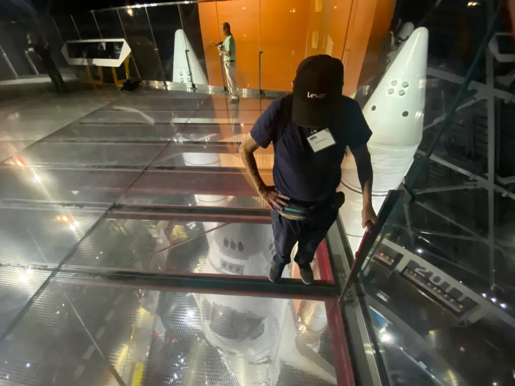 Visitors on an observation glass deck to see Endeavour on...
