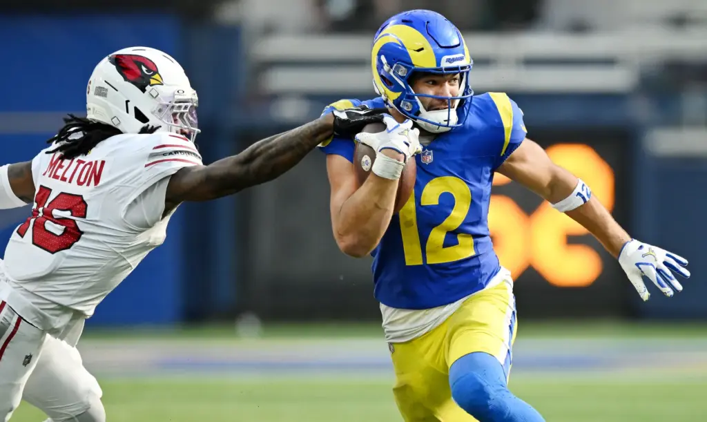 Rams wide receiver Puka Nacua (12) runs for extra yards...
