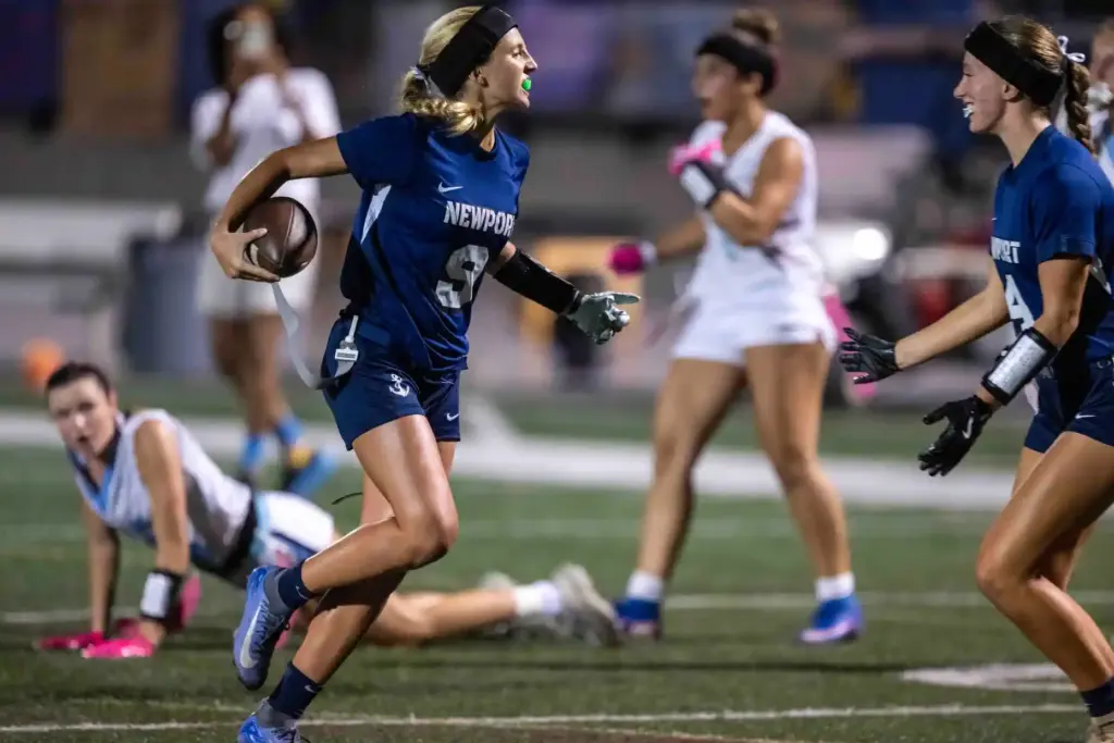 Newport Harbor quarterback Scarlett Guyser (9) scores a touchdown on...