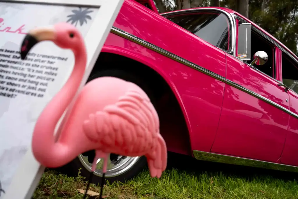 A pink flamingo is stuck into the ground beside âPinkie,â...