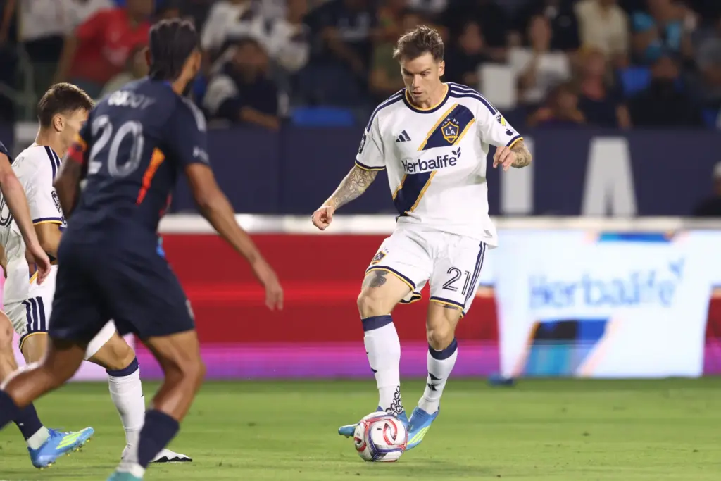 Los Angeles Galaxy midfielder Robert Taylor (21) controls the ball...
