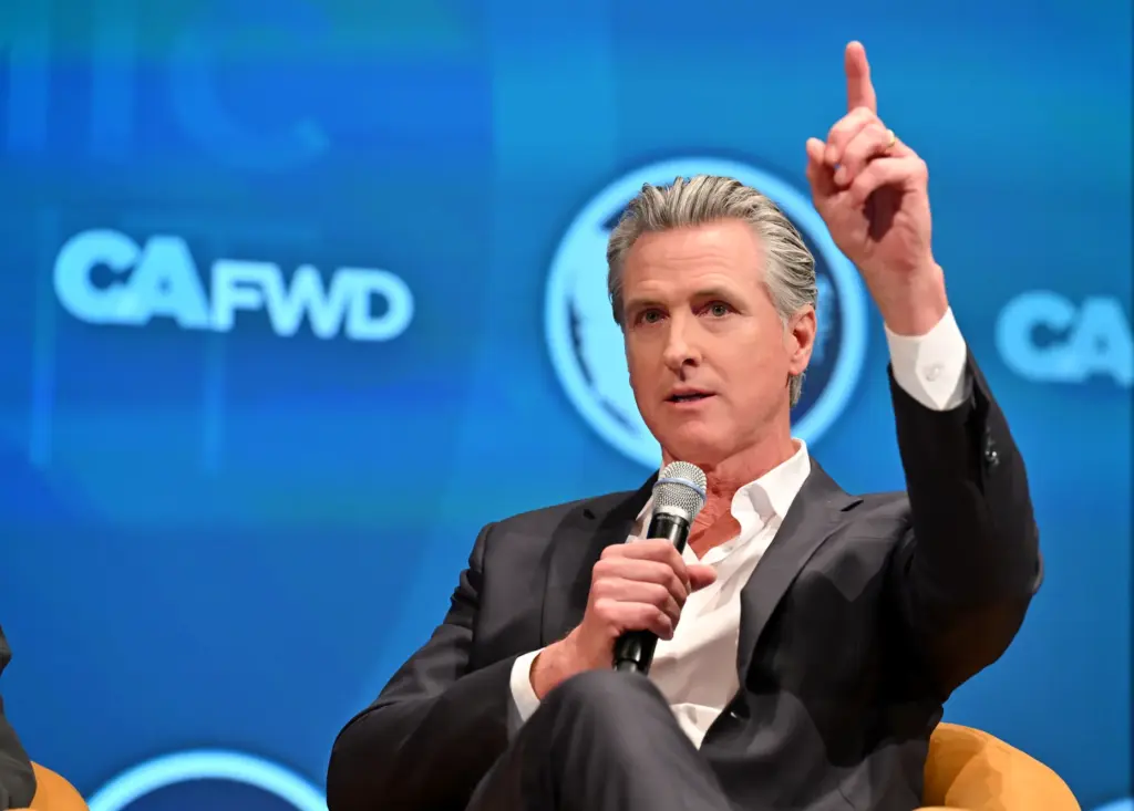 Governor Gavin Newsom participates in a fireside chat with former...