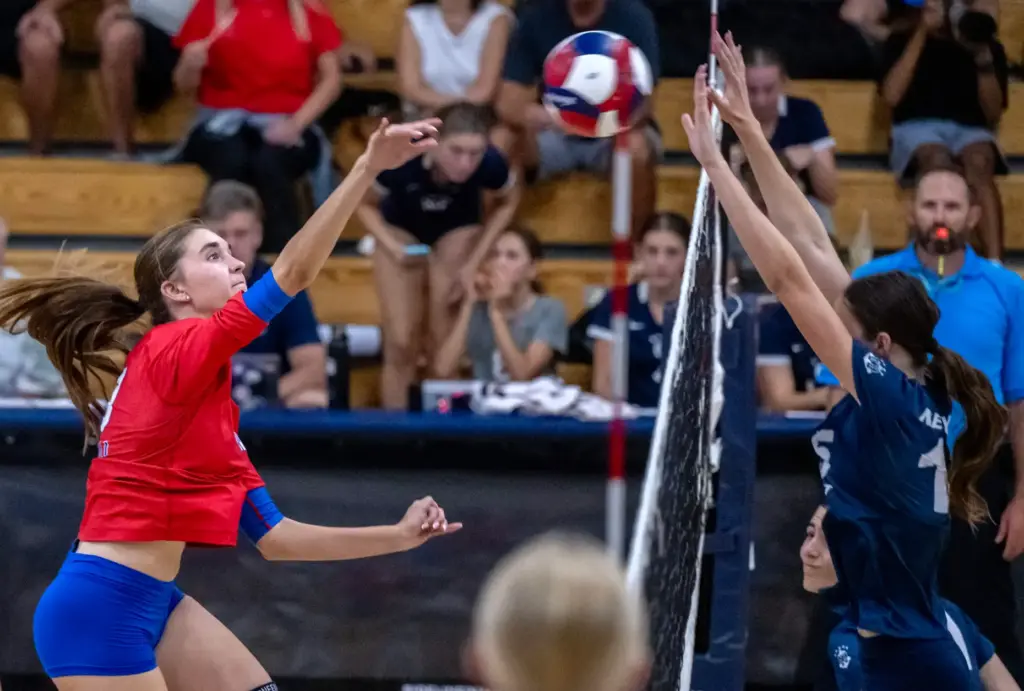 Los Alamitos middle blocker Audrey Belikoff (10) hits the ball...