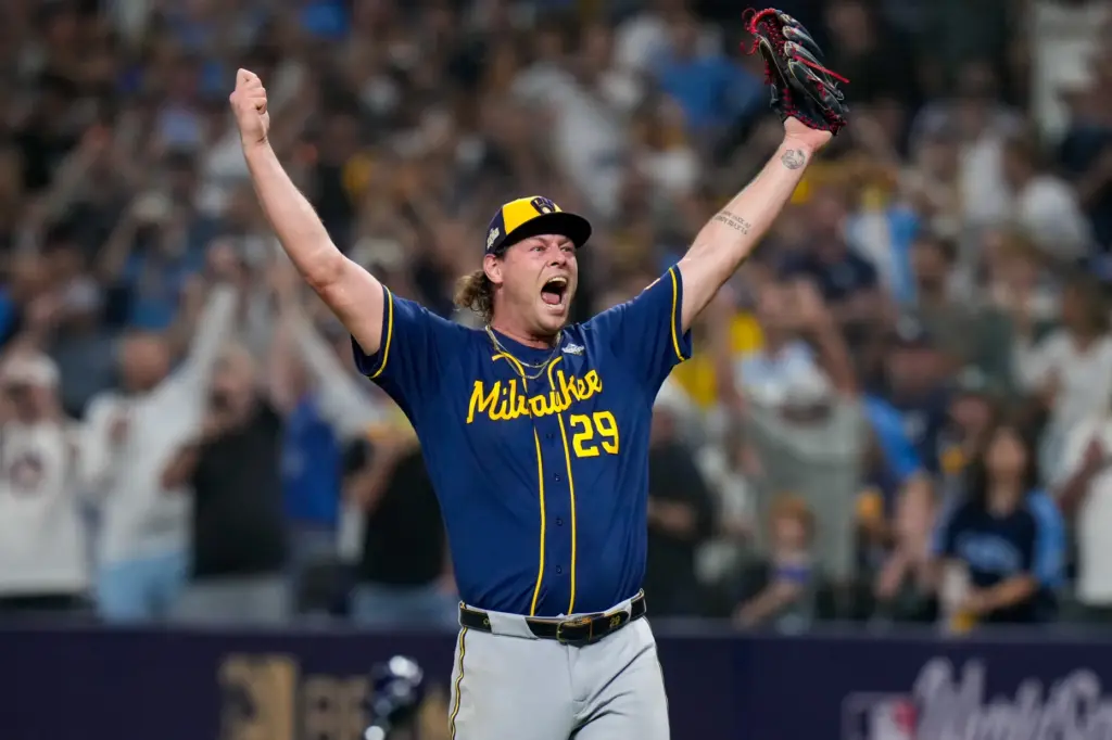 Milwaukee Brewers pitcher Trevor Megill celebrates after winning baseball’s World...