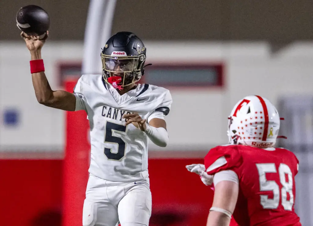 Canyon quarterback Kayden Phillips (5) throws the ball during a...