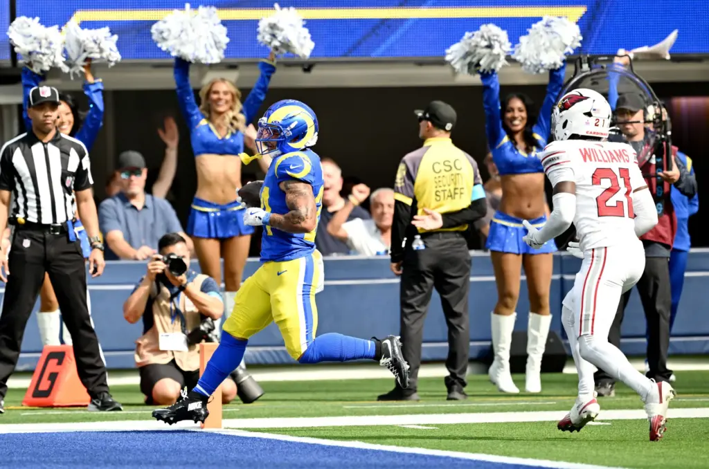 Rams running back Blake Corum (24) scores on a short...