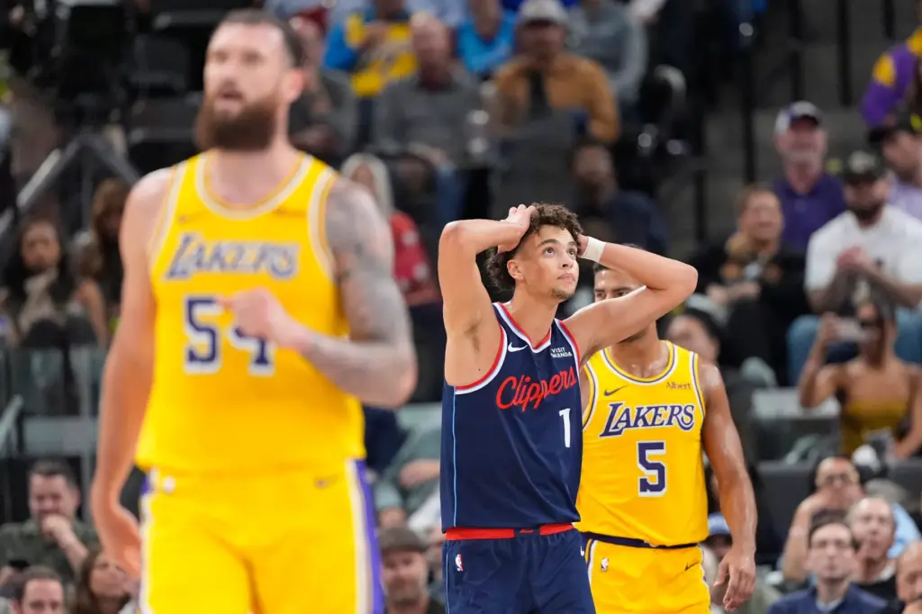 Clippers rookie guard Keaton Wagler, center, reacts after Lakers guard...