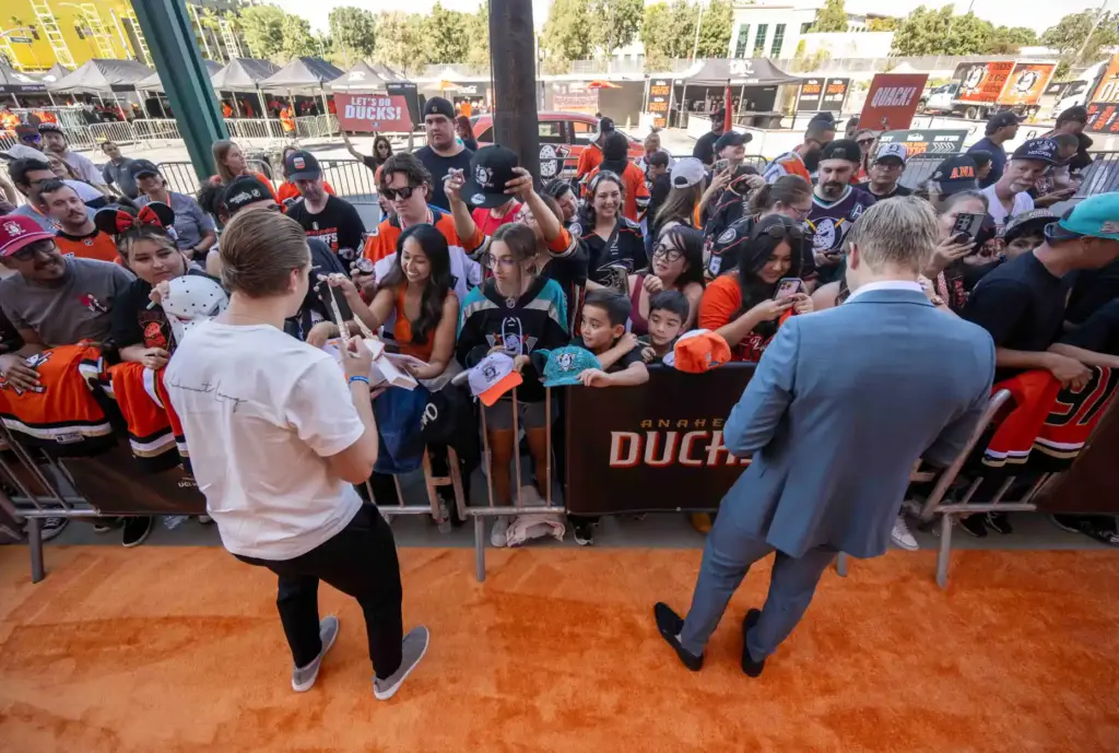 Ducks players Pavel Mintyukov, left, and Ville Husso make their...