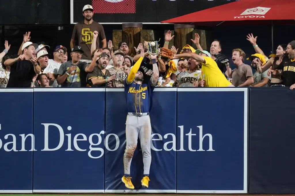 Milwaukee Brewers center fielder Garrett Mitchell catches a ball hit...