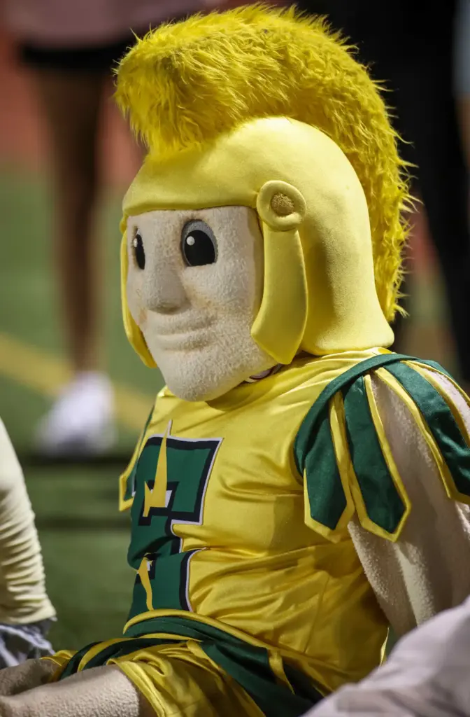 Edison High mascot, a Charger, watches from the sideline as...
