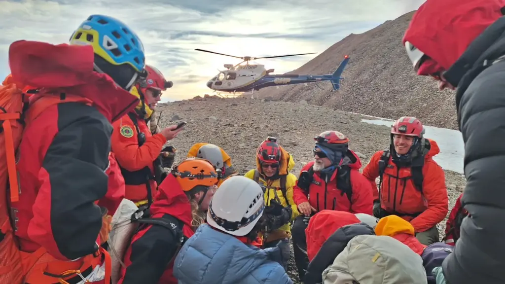 A team of volunteers from multiple agencies, climbed to the...