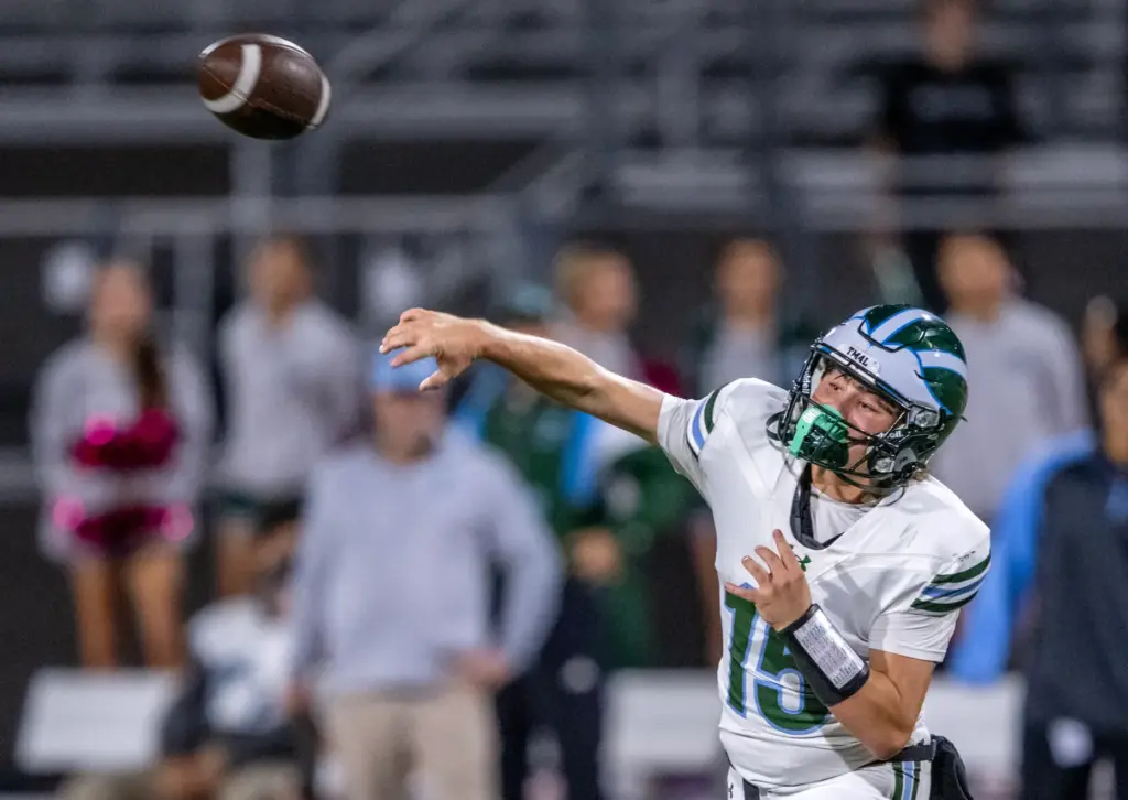 Irvine quarterback Ronin Scheinblum (15) throws the ball during a...