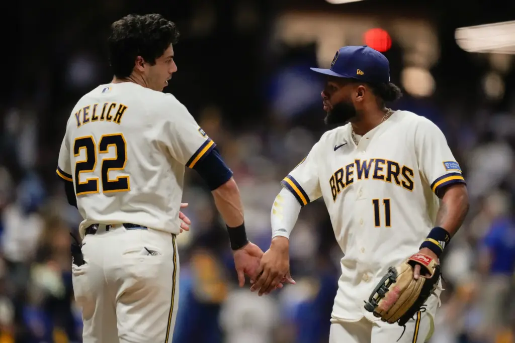 Milwaukee Brewers left fielder Jackson Chourio, right, celebrates with designated...
