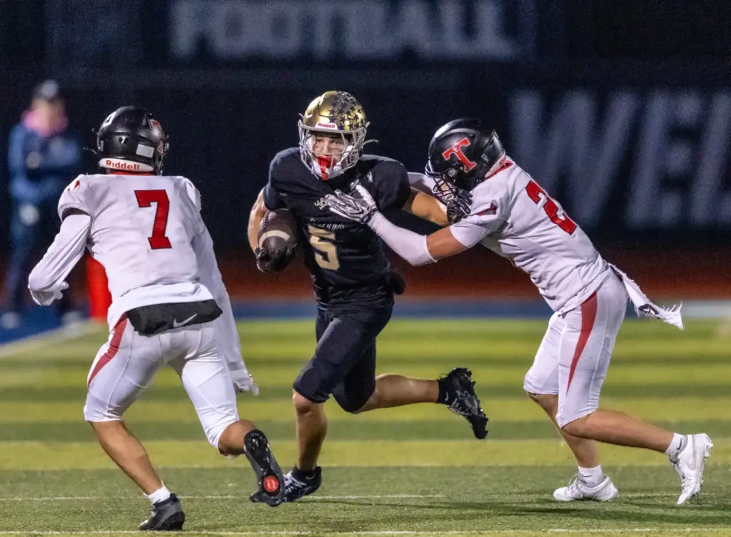 San Juan Hills wide receiver Luke Frith (5) carries the...