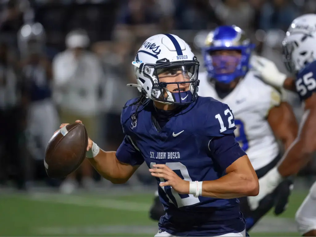 St. John Bosco quarterback Koa Malau’ulu looks for a receiver...