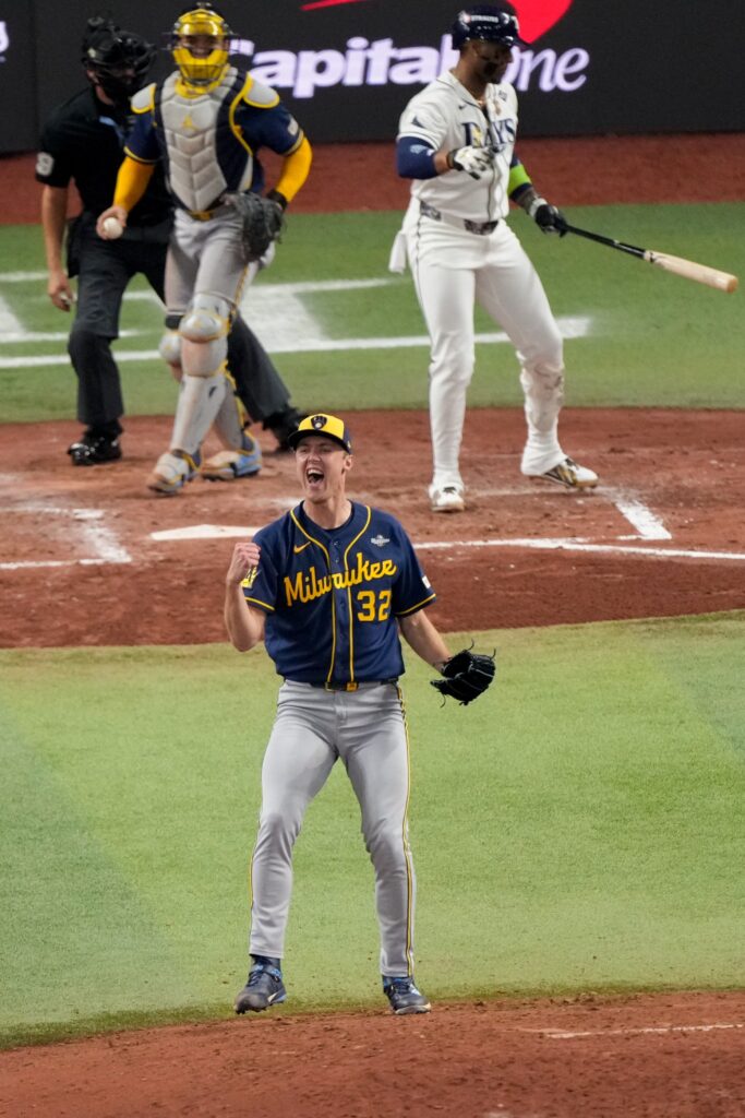 Milwaukee Brewers starting pitcher Jacob Misiorowski celebrates after striking out...