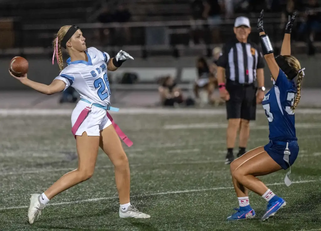 Corona del Mar quarterback Charlotte Ring (26) throws the ball...